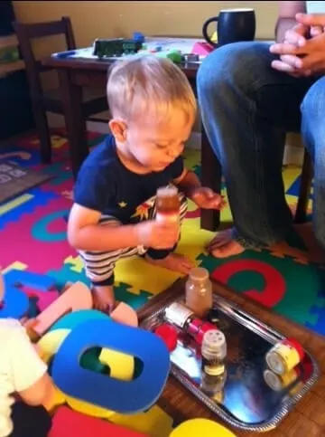A child smelling spices
