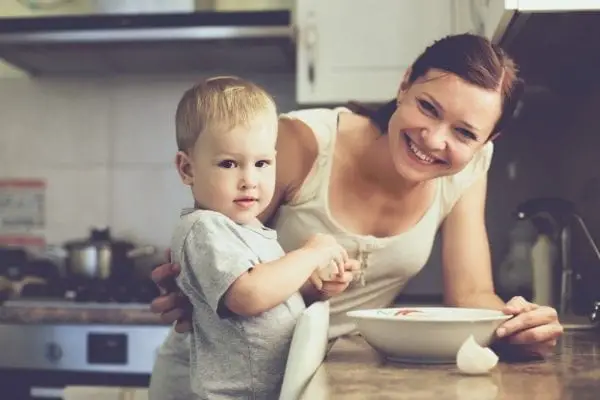 A happy mom and her son in the kitchen 