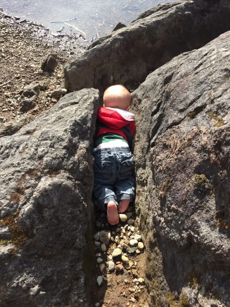A child exploring the rocks