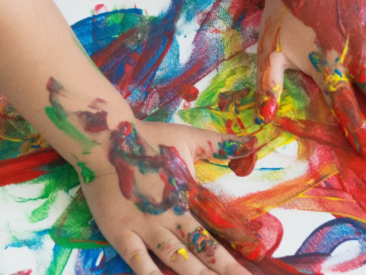 Kids painting with their fingers