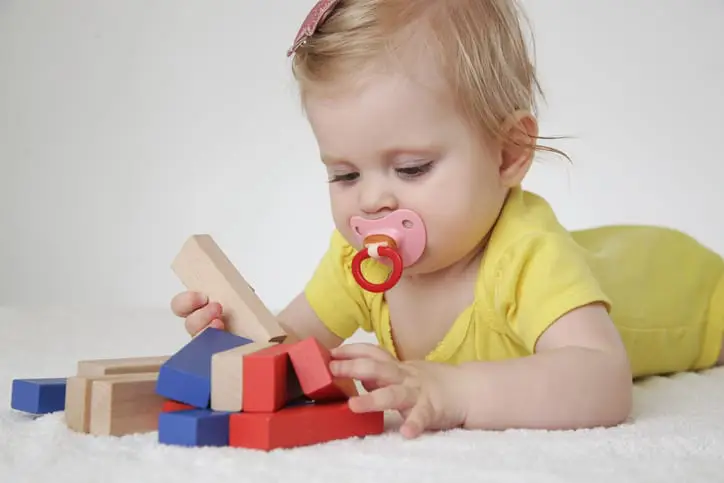 picture of baby playing with montessori toys