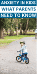 A young boy riding on a bike