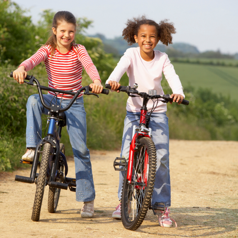 two young girls riding bikes