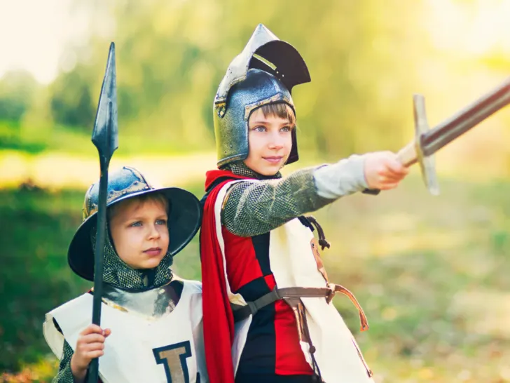two young boys dressed as knights