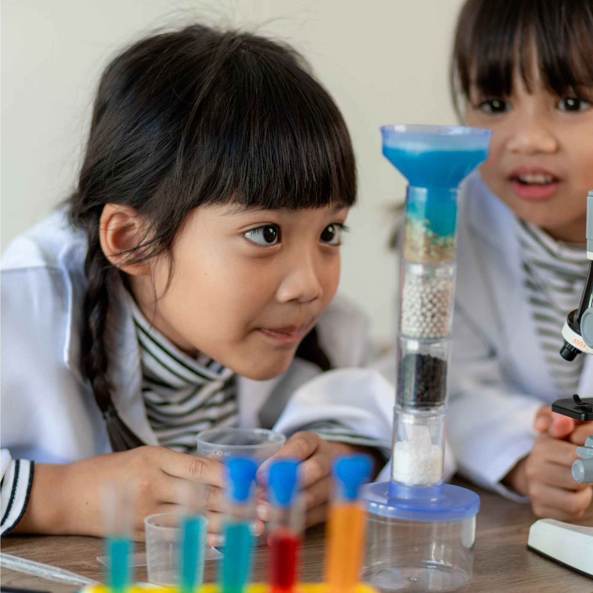 a young girl working on a science experiment