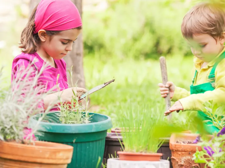 two-young-kids-potting-plants