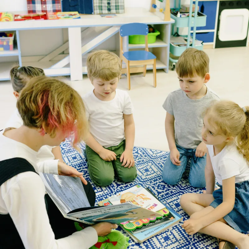 a-teacher-reading-to-children-in-a-classroom-